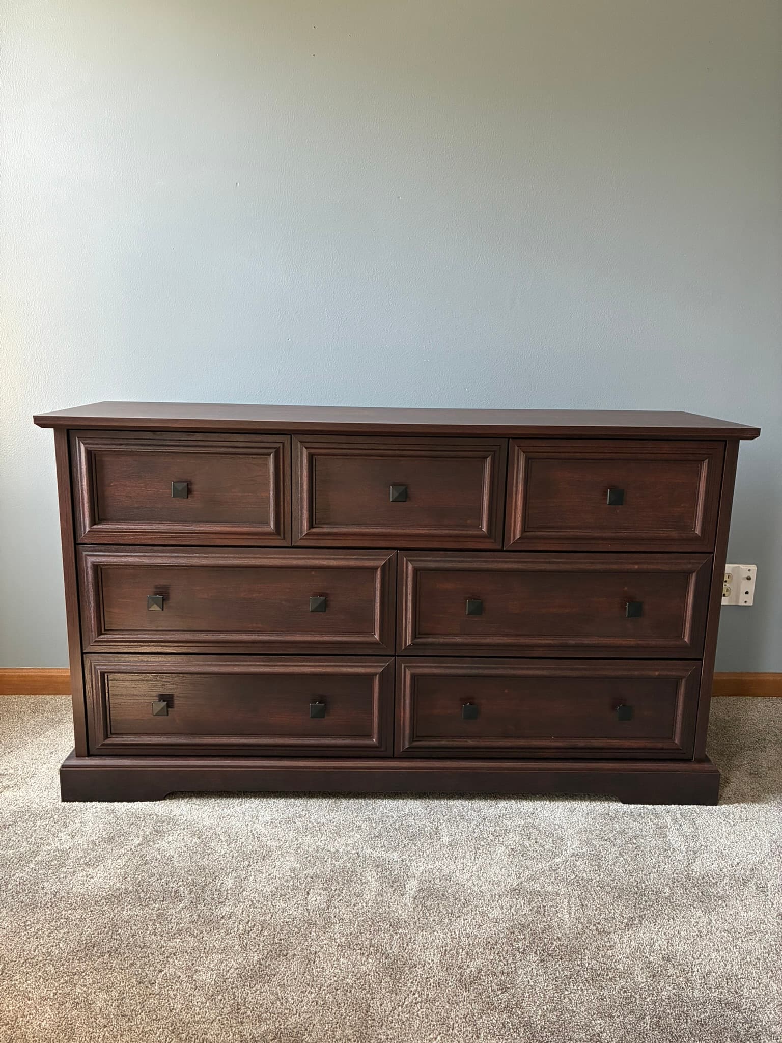 Assembled dark wood dresser with drawers