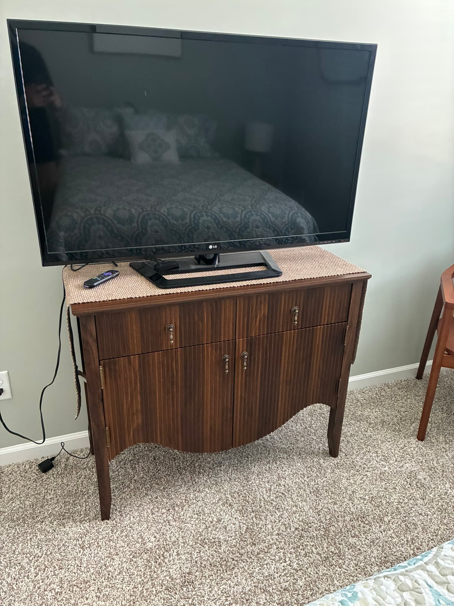 Assembled TV stand with television on top