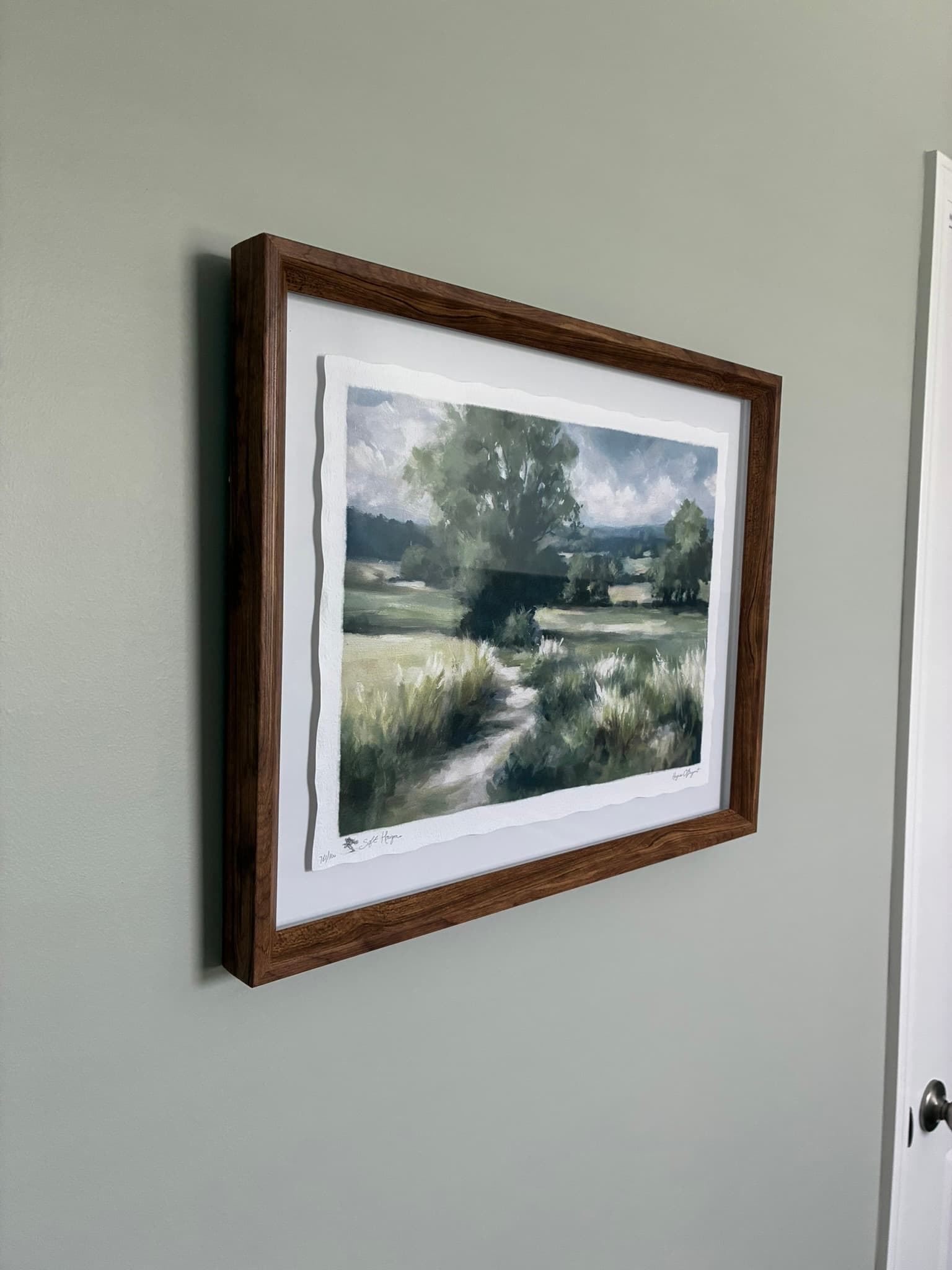 Wall art hung by our handyman team